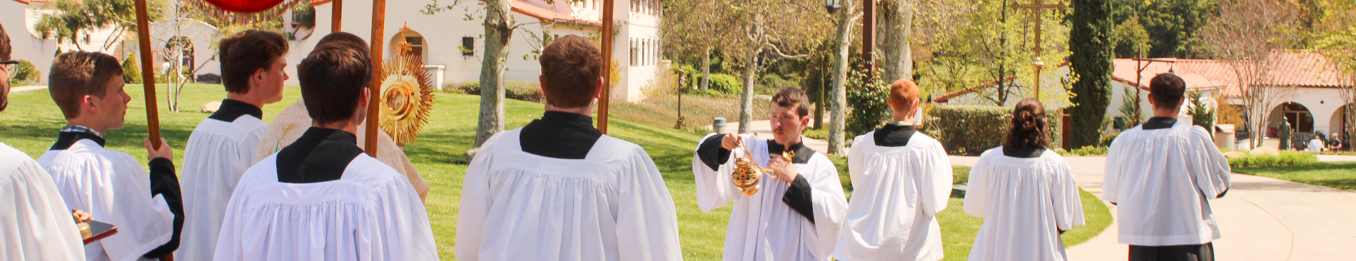 The thurifer incenses Fr. Marczewski and the monstrance