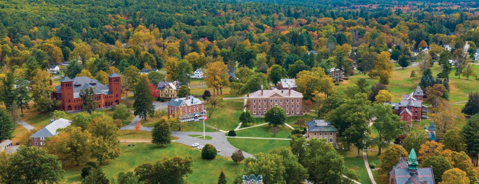 Ariel view of the campus with trees in the background