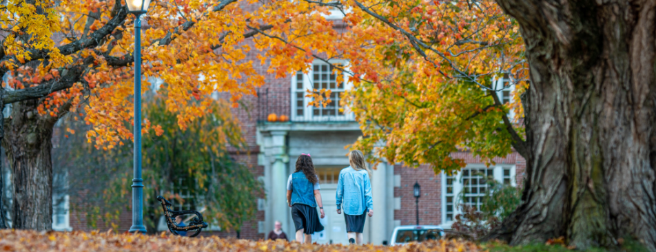 Girls walking toward Gould Hall.