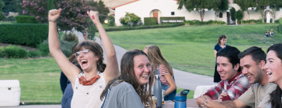 Students cheer during an outdoor game of Trivial Pursuit