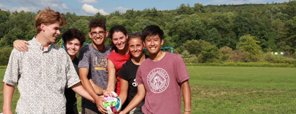 Students pose with a volleyball