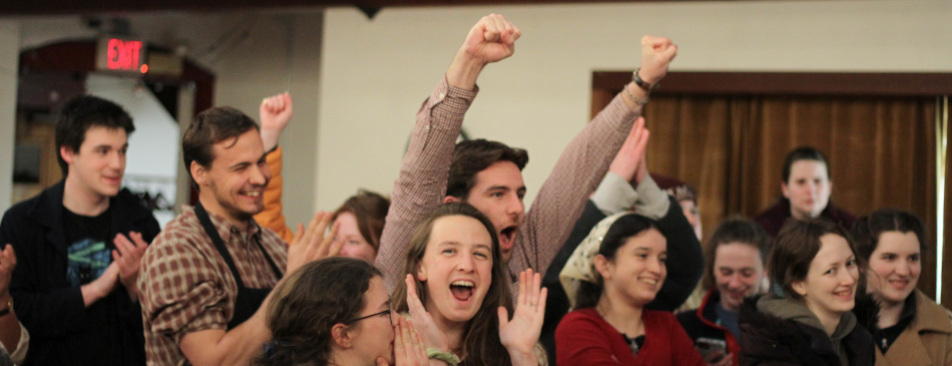 Students cheer as the last thesis is turned in