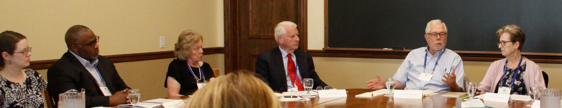 Summer Seminar attendees, guided by Dr. McLean, discuss the text