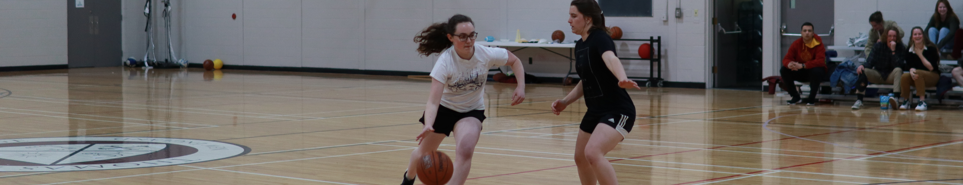 Students play basketball