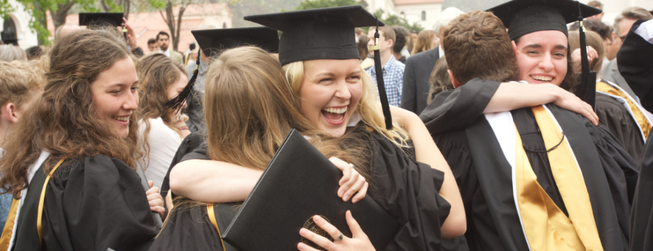 Graduates hug