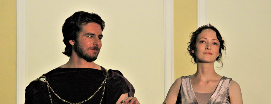 Students in elaborate costume perform as Aeneas and Dido
