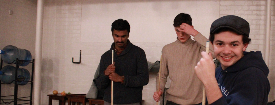 Three students playing pool