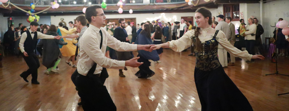 A pair of students dance