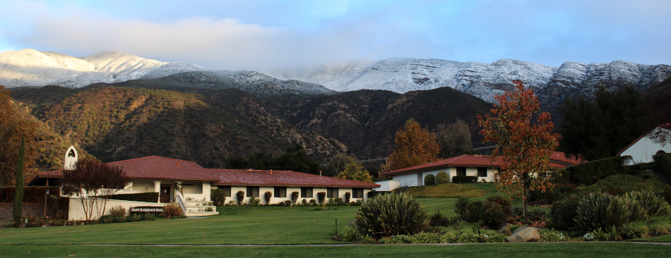 A view of the California campus, snow-capped mountains in the distance